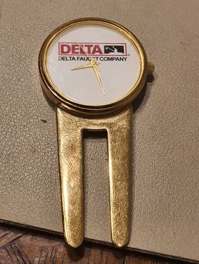 10/$20 Delta Faucet Company Goldtone/White Divot Repair Tool Watch